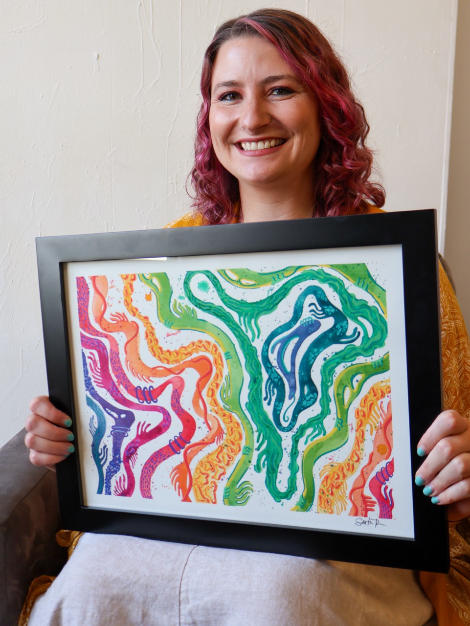 Sam Rowe with her artwork