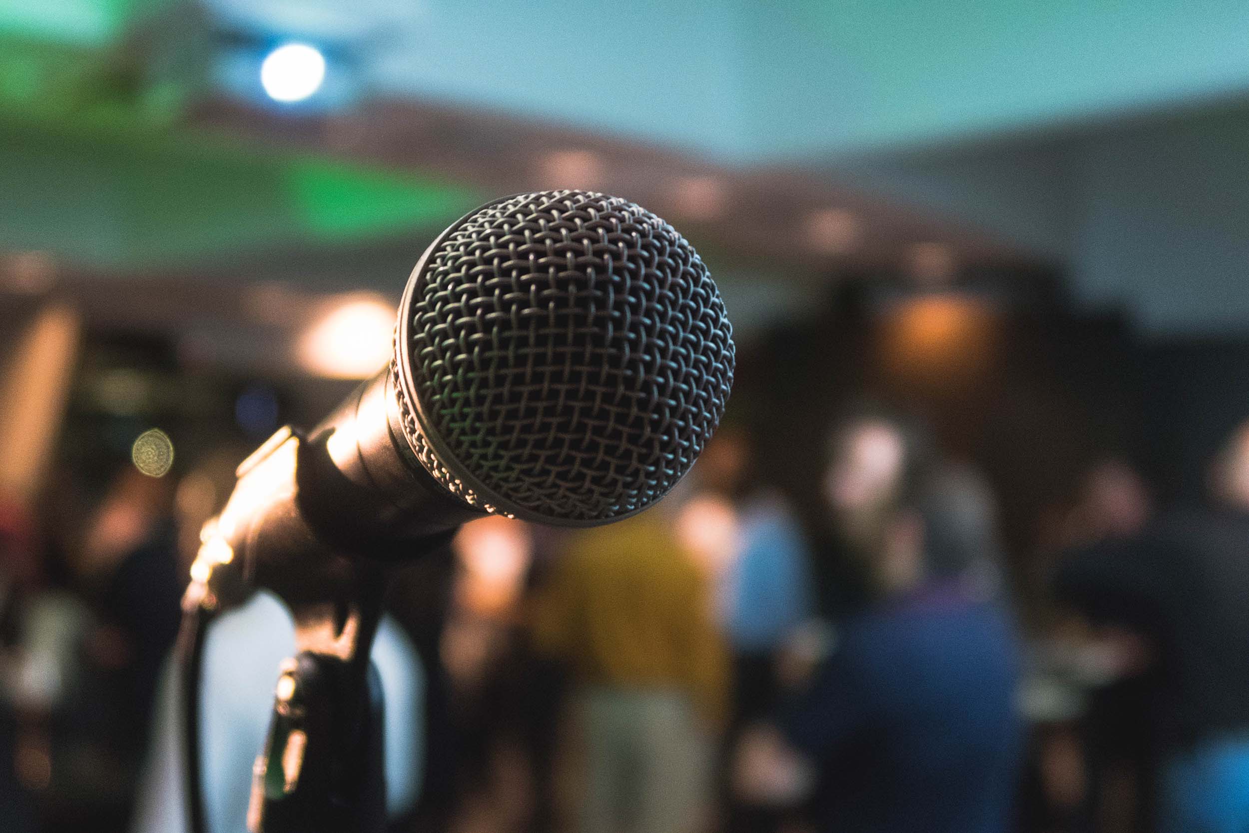 microphone with a crowd in the background